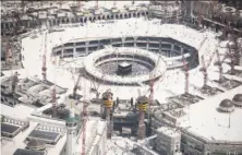  ?? Mohammed al-Shaikh / AFP / Getty Images ?? An aerial view shows the Grand mosque and the Kaaba (center) in Saudi Arabia’s holy Muslim city of Mecca.