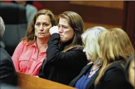  ?? PHOTOS BY BOB ANDRES/BANDRES@AJC.COM ?? Tex McIver supporter Annie Anderson (center) — his personal masseuse who was forced to testify about an alleged affair that wasn’t — is overcome with emotion after the verdict. She and another backer ran out of the courtroom in tears as McIver,...