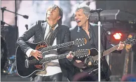  ?? DAVID RICHARD — THE ASSOCIATED PRESS ?? Richie Sambora, left, and Jon Bon Jovi perform during the Rock and Roll Hall of Fame induction ceremony on Saturday in Cleveland.