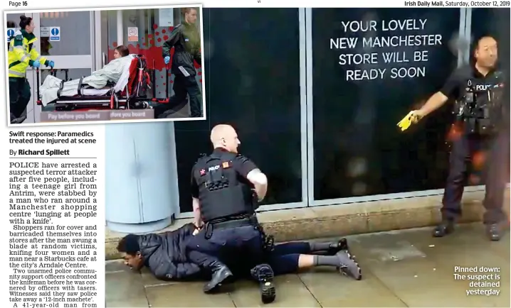  ??  ?? Swift response: Paramedics treated the injured at scene This is a caption This is a caption This is a caption This is a caption This is a caption This is a caption This is a caption This is a caption Pinned down: The suspect is detained yesterday