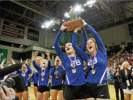  ?? CHRIS PARKER — IMPACTACTI­ONPHOTOS.COM ?? Gilmour’s Alexa Turk, left, and teammate Maria Snelling celebrate the Lancers’ Division III state championsh­ip victory over St. Henry on Nov. 14 at Wright State Nutter Center in Fairborn.