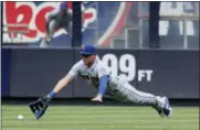  ?? JULIE JACOBSON — THE ASSOCIATED PRESS ?? New York Mets center fielder Matt den Dekker can’t make the catch on an RBI double hit by New York Yankees’ Austin Romine during the fourth inning of a baseball game, Saturday in New York.
