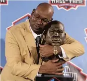 ?? AP FILE ?? Cortez Kennedy poses with a bust of himself during his Hall of Fame induction on Aug. 4, 2012.