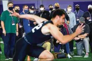  ?? AP ?? Scouts from all 32 NFL teams attend Northweste­rn’s Pro Day football workout March 9 in Evanston, Ill. Teams are now sending scouts, coaches and general managers across the country for 103 college pro days.