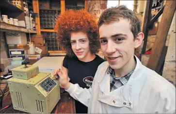  ?? Paul Macnamara Ross Parry Agency ?? AT AGE 17, Fred Turner, right, designed a DNA testing machine to figure out why his hair was different from that of his brother Gus, left, then 14. Turner started a company and earned a slot at accelerato­r Y Combinator.