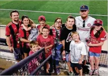  ?? COURTESY OF JOSH PROCTOR ?? Atlanta United fan Josh Proctor (second from right) forgets his troubles with friends and family at a game.