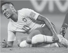  ?? FRANCISCO SECO/AP ?? Brazil’s Neymar holds his shin during the quarter-final Friday between Brazil and Belgium that saw Brazil’s hopes for a sixth World Cup title dashed by a 2-1 Belgium victory in Kazan, Russia.