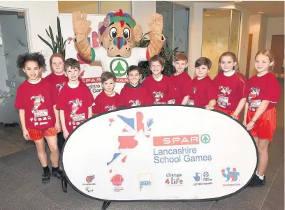  ?? Pupils from Westhead Lathom St James CE Primary School with the Lancashire Lion ??