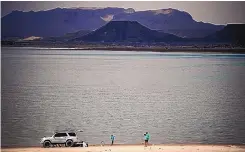  ?? ROBERTO E. ROSALES/JOURNAL ?? A family camps on the beach at Elephant Butte Lake in June 2022.