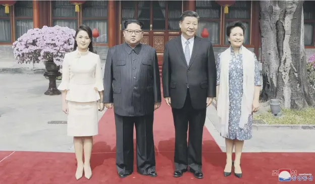  ?? PICTURE; GETTY IMAGES ?? 0 North Korea’s Kim Jong-un, second left, and his wife Ri Sol Ju pose in Beijing with China’s President Xi Jinping and his wife Peng Liyuan