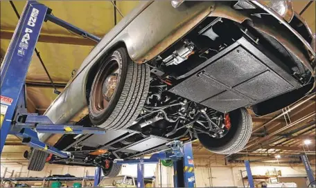  ?? Photograph­s by Myung J. Chun Los Angeles Times ?? A 1949 MERCURY
Coupe, converted by Icon in Chatsworth, uses batteries in front and back, including where the gas tank used to be.