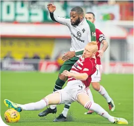  ??  ?? Olivier Ntcham and Ziggy Gordon battle for the ball