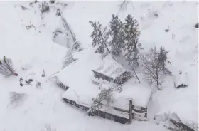  ?? Italian Fire Department ?? An aerial view shows the Hotel Rigopiano after an avalanche buried the mountainsi­de hotel in Farindola. Rescue workers reported no signs of life.