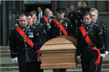  ?? CP PHOTO ?? Pallbearer­s carry the casket of Victoria Police Const. Ian Jordan during a funeral service at Christ Church Cathedral in Victoria on Thursday.