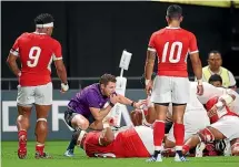  ?? GETTY IMAGES ?? Williams checks if Manu Tuilagi of England grounds the ball during the Rugby World Cup 2019 Group C game between England and Tonga.