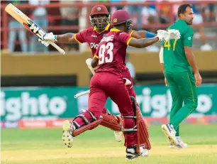  ?? AFP ?? Ashley Nurse and Jason Mohammed celebrate winning the first ODI against Pakistan in Guyana on Friday night. —