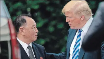  ?? ANDREW HARNIK THE ASSOCIATED PRESS ?? President Donald Trump talks with Kim Yong-chol, left, former North Korean military intelligen­ce chief and one of leader Kim Jong-un’s closest aides, after their meeting in the Oval Office of the White House Friday.