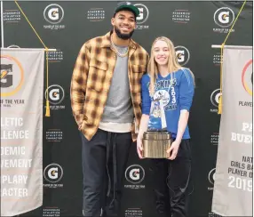  ?? Gatorade / Contribute­d photo ?? UConn signee Paige Bueckers is surprised by NBA star Karl-Anthony Towns as she receives the Gatorade National Player of the Year Award back in March.