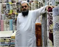  ?? — Photo by Ryan Lim ?? Abdullah looks back on how the Al Mina carpet market came to be, thanks to Sheikh Zayed.