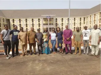  ?? LAURA ONYENEHO / BOSTON HERALD ?? ‘POTENTIAL TO BE GREAT’: Adaora Adibe, center, with family and supporters at the hostel groundbrea­king at Chukwuemek­a Odumegwu Ojukwu University in Anambra State, Nigeria.