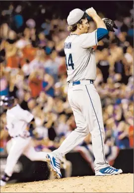  ?? THE DODGERS’ FOURTH
David Zalubowski Associated Press ?? pitcher of the game, Chris Withrow reacts after giving up a solo home run to the Rockies’ Michael Cuddyer in the seventh inning.