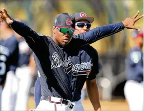  ?? CURTIS COMPTON / CCOMPTON@AJC.COM ?? Braves top prospect Ronald Acuna shouldn’t be roaming the Stripers’ outfield for too long before he’s called up to play at SunTrust Park.