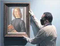  ??  ?? Botticelli’s Young Man Holding A Roundel at Sotheby’s in New York.