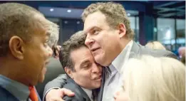  ?? | SANTIAGO COVARRUBIA­S/ SUN- TIMES ?? Comedians Mario Cantone ( left) and Jeff Garlin hug Wednesday at the opening night of “Hamilton” at the PrivateBan­k Theatre.
