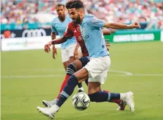  ?? AP ?? Manchester City’s Riyad Mahrez goes for the ball during the first half of an Internatio­nal Champions Cup match against FC Bayern last week.