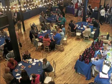  ?? NICHOLAS BUONANNO — NBUONANNO@TROYRECORD.COM ?? Brown’s Revolution Hall filled up quickly Thursday night for the 7th annual Comfort Cuisine fundraiser for the Troy Boys & Girls Club.