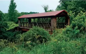  ??  ?? The Old Highway 131 Trail crosses the Kickapoo River via Bridge 18 in the Kickapoo Valley Reserve.