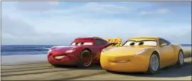  ?? DISNEY-PIXAR VIA AP ?? This image released by Disney shows Lightning McQueen, voiced by Owen Wilson, left, and Cruz Ramirez, voiced by Cristela Alonzo in a scene from “Cars 3.”