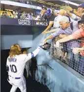  ?? Robert Gauthier Los Angeles Times ?? JUSTIN TURNER celebrates his game-winning homer for the Dodgers in Game 2 of the 2017 NLCS.