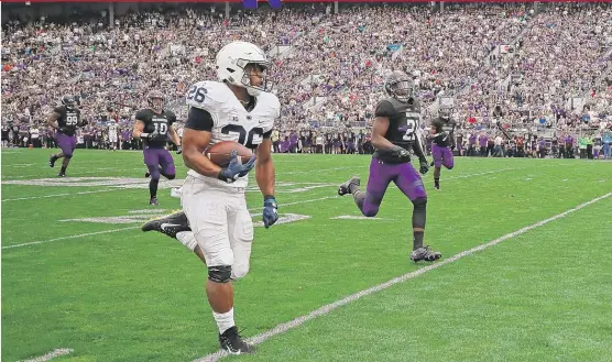  ?? | GETTY IMAGES ?? Penn State star Saquon Barkley breaks free for a 53- yard touchdown run Saturday against Northweste­rn.