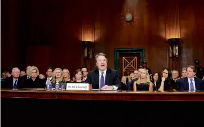  ?? —AP/REUTERS ?? SHE SAID, HE SAID Christine Blasey Ford, 51, (left) calmly tells US senators on Thursday that she is “absolutely” sure that US Supreme Court nominee Brett Kavanaugh (right, center) tried to rape her when she was just 15. He vigorously denies the allegation, stressing: “You may defeat me in the final vote, but you’ll never get me to quit.”