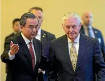  ?? PHOTO: REUTERS ?? Chinese Foreign Minister Wang Yi and US Secretary of State Rex Tillerson arrive for a joint press conference at Diaoyutai State Guesthouse in Beijing.