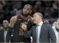  ?? TONY DEJAK — THE ASSOCIATED PRESS FILE ?? In this file photo, Cleveland Cavaliers coach Tyronn Lue talks with LeBron James during the second half of Game 3 of basketball’s NBA Finals against the Golden State Warriors, in Cleveland.