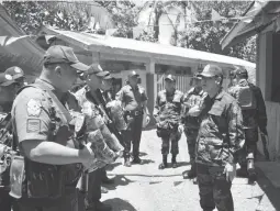  ??  ?? 2019 MID-TERM ELECTIONS – Chief Supt. Gilberto DC Cruz (right), regional director of Northeaste­rn Mindanao Police Regional Office 13 (PRO 13) gives instructio­ns to field unit commanders on the security plan being laid out for the 2019 mid-term elections at Camp Col. Rafael C. Rodriguez, Butuan City on Tuesday, January 8. (PRO 13/Mike U. Crismundo)