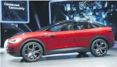  ?? SEAN GALLUP/GETTY IMAGES ?? The Volkswagen ID Crozz electric crossover concept car stands on display at the Frankfurt auto show Tuesday. Carmakers are investing heavily on electric cars to meet tough regulation­s.