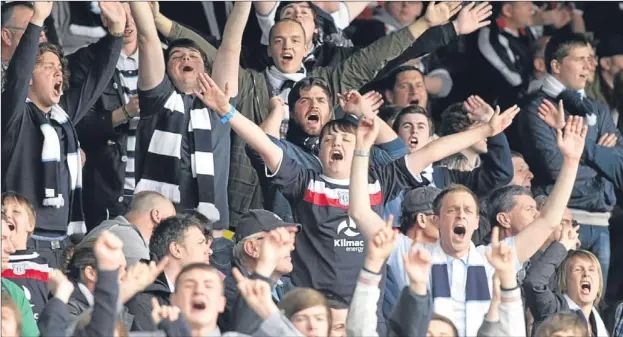  ??  ?? Dark Blues fans at the derby between Dundee and Dundee United on Saturday. Now the local clashes will include meetings with St Johnstone.