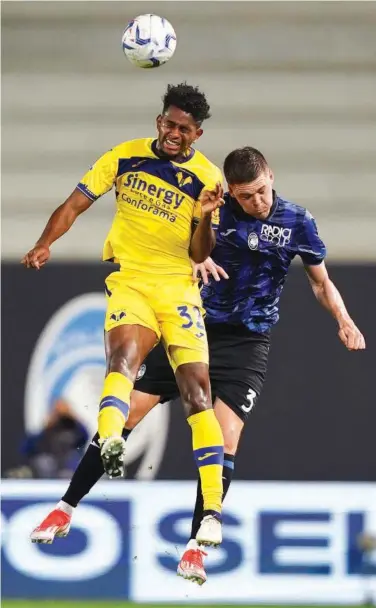  ?? Associated Press ?? Atalanta’s Emil Holm (right) vies for the ball with Verona’s Juan Cabla during their Italian League match on Monday.