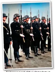  ?? ?? An honour guard of the Leibstanda­rte at Berlin’s Tempelhof Airport on 24 March 1934 in the original all-black uniform (Bruce Quarrie)