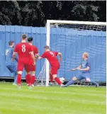  ??  ?? Quorn’s Dominic Brennan pounces on a mistake by Holbrook keeper to score Quorn’s opening goal. Picture by Eric Gregory.