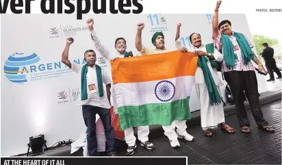  ??  ?? ( Above) Activists from India protesting against the World Trade Organizati­on’s 11th ministeria­l conference inside the hotel where the conference was being held in Buenos Aires, Argentina, on December 12, 2017