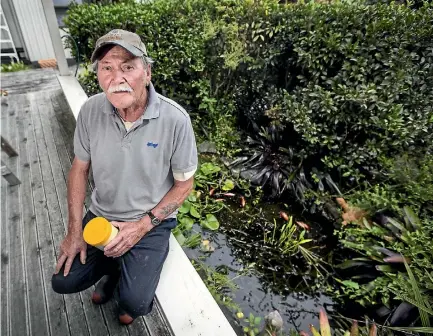  ?? PHOTO: ANDY JACKSON/STUFF ?? Newt Warren says he will take a few days and clean his pond before taking up people’s offers to repopulate the pond with fish.