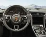  ??  ?? Below and right: changes to cabin include smaller steering wheel and Sport-tex seat fabric. Bottom right: external clues include new lip spoiler, grey mirrors… and Carrera T script