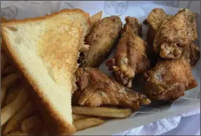  ?? (Arkansas Democrat-Gazette/Eric E. Harrison) ?? Slim Chickens recently introduced dry-rub wings to the menu, in Lemon Pepper (shown) and Cayenne Ranch.