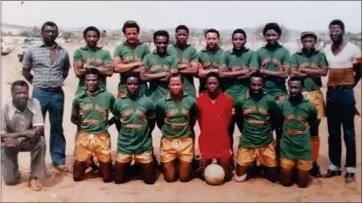  ?? ?? Devoted cadre...Neidel (3rd from left - standing), proudly attired in the lemon and grass strip of exciting Nomtsoub outfit Chief Santos FC. Back row from left: Gotfriedt ‘Bill’” Nawaseb (d+), Gregor Corrie Uri-Khob (d+), Bonny ‘Mannetjie’ Neidel, Festus Kavindjima, Benzil Khodiseb (d+), Max Johnson, Felix Uirab, Lamola Ekandjo (d+), Ben Neiseb, Adios Aochamub (coach). Front row from left: Robert Maposa, Chris Amakali (d+), Naftali Goraseb, Constance Neidel, Dave Gaeseb, Sagarias ‘Selle’ Auchumeb (d+), Frans ‘Archie’ Ochurub.