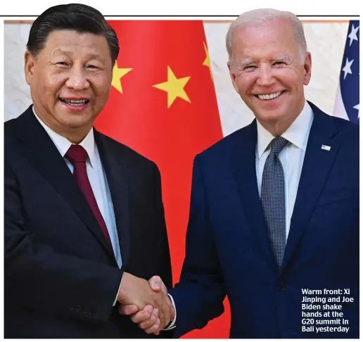  ?? ?? Warm front: Xi Jinping and Joe Biden shake hands at the G20 summit in Bali yesterday