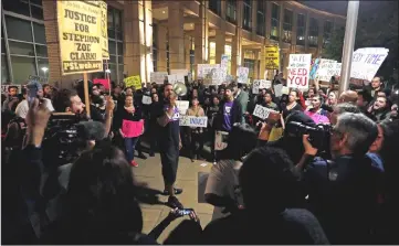  ??  ?? Demonstrat­ors gather outside City Hall to protest the police shooting of Clark. — Reuters photo